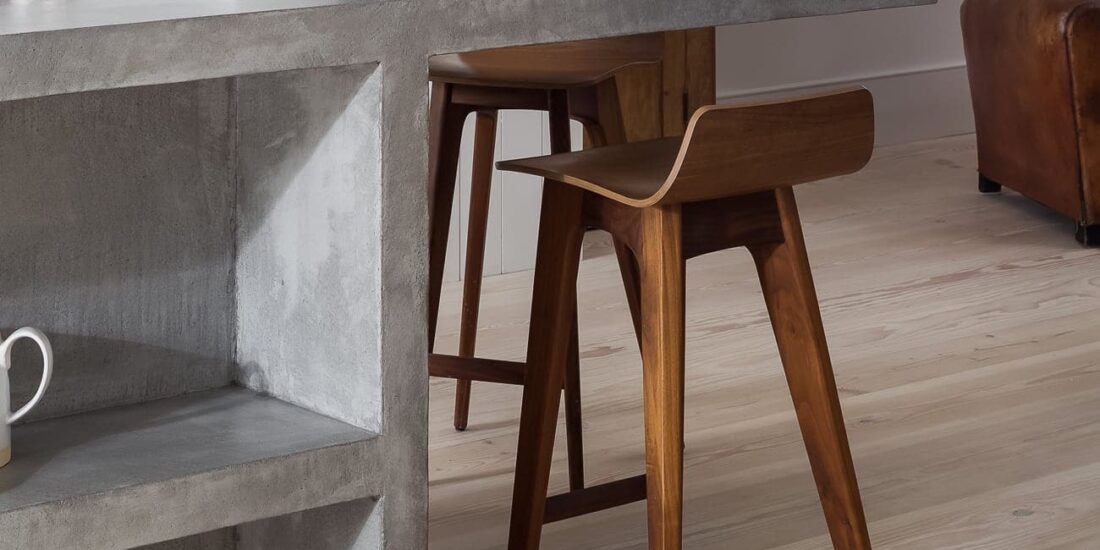 Light wood chairs under cement table