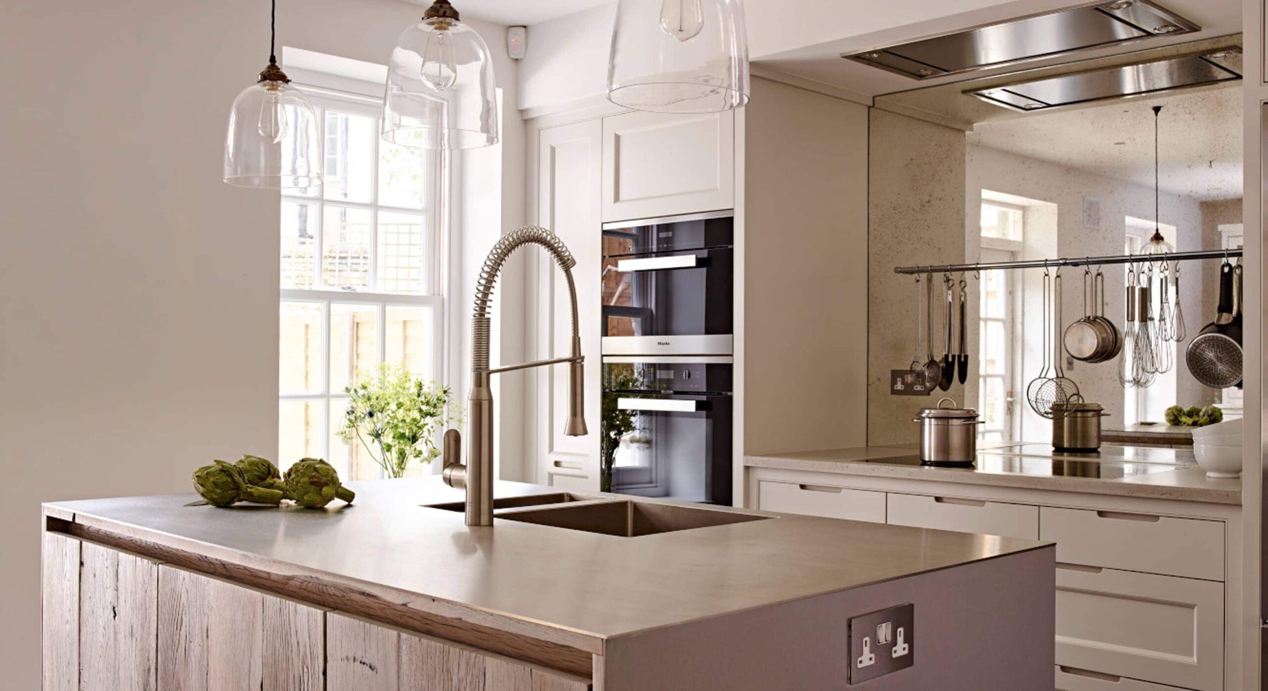 Modern kitchen concept with mirrored splashback