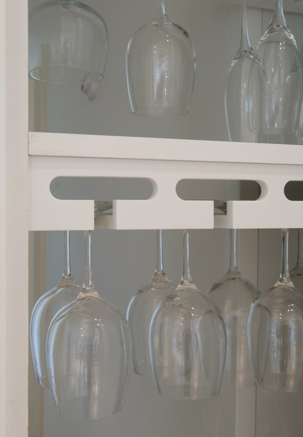 Glass holders in cabinets from the Westbourne kitchen concept